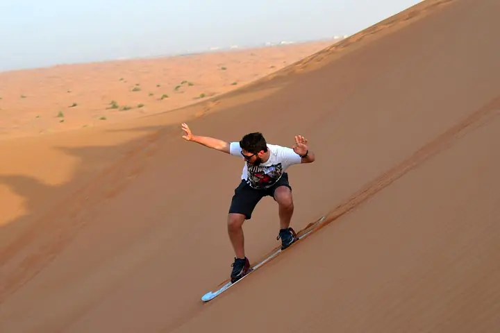 Sandboarding in the UAE Desert : A Thrilling Ride Across Golden Dunes